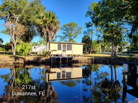 Waterfront in Suwannee with RV and cookshed